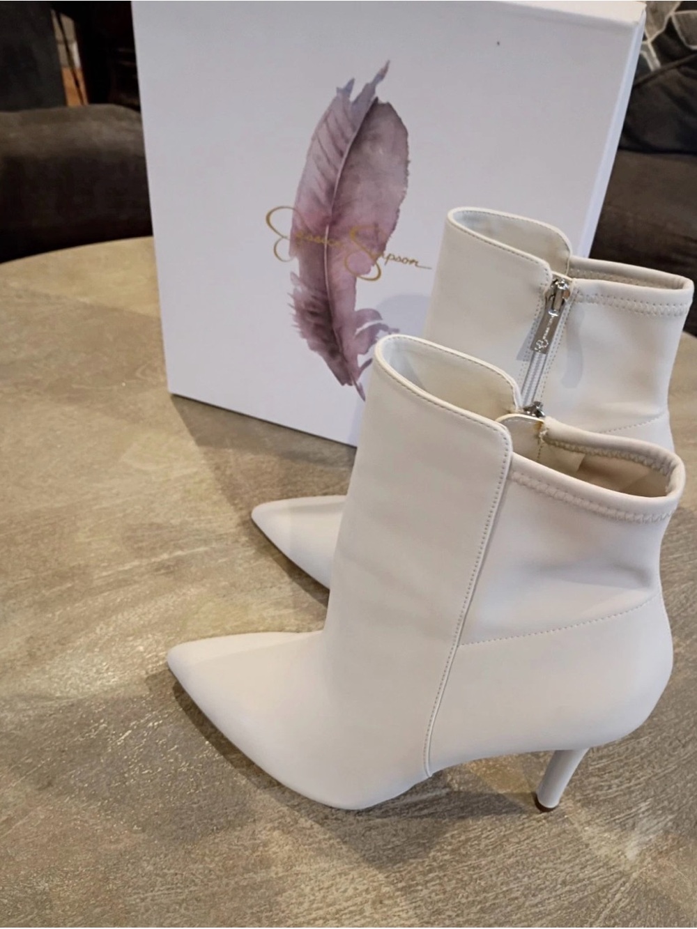 White leather ankle boots by Jessica Simpson